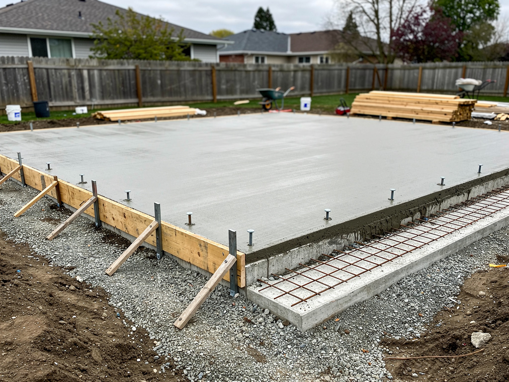 Finished monolithic concrete slab foundation for a detached garage in Willis, TX